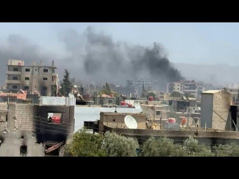 Smoke billows as Syria tribal fighters deploy in Druze village near Sweida | AFP