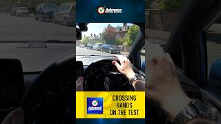 Is crossing hands a fail on the driving test?
