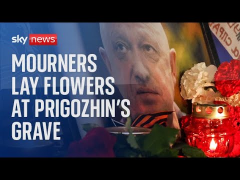 Mourners lay flowers following Wagner boss Yevgeny Prigozhin's private funeral