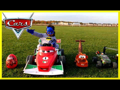 Kid plays at outdoor playground with Disney Cars ride on and RC Monster Trucks!