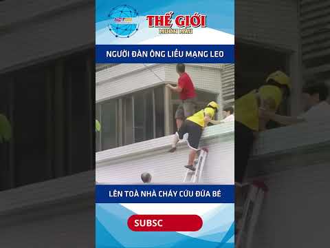 Người đàn ông liều mạng leo lên toà nhà bốc cháy cứu đứa bé