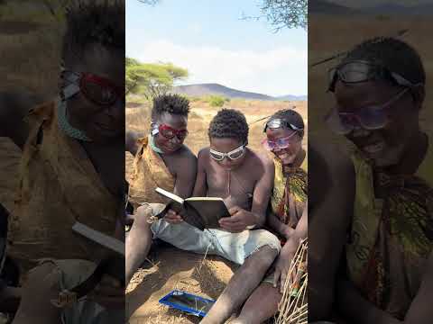 Hadzabe Tribe bushmen teacher Chabba is here with new hobby of reading and learning 😅🥰