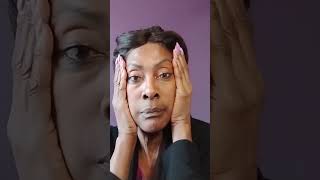 Does this 68 year old woman think holding her face in place will eliminate her sagging skin