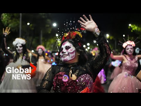 YouTube video thumbnail: Hundreds Celebrate Day of the Dead in Mexico City With Catrinas March