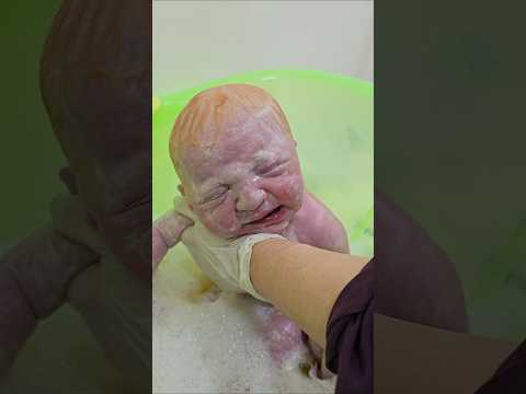 blond baby first bath