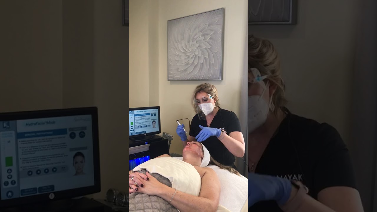 Facial treatment in a skincare clinic setting.