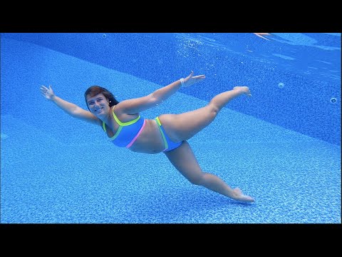 Swimming Underwater Laps in Blue Bikini in Swimming Pool