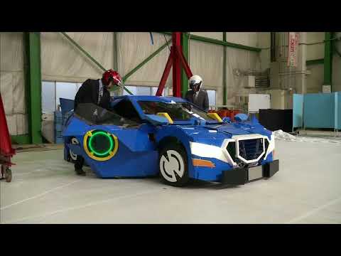 Japan engineers create robot that transforms into car with men on-board