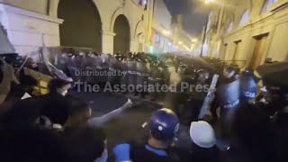 Tear gas fired as police crack down on young demonstrators marching in Peru capital