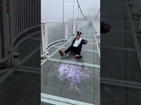 look The child start cry as soon as he reache the glass bridge