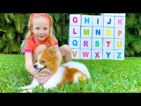 Stacy and dad learn the English alphabet