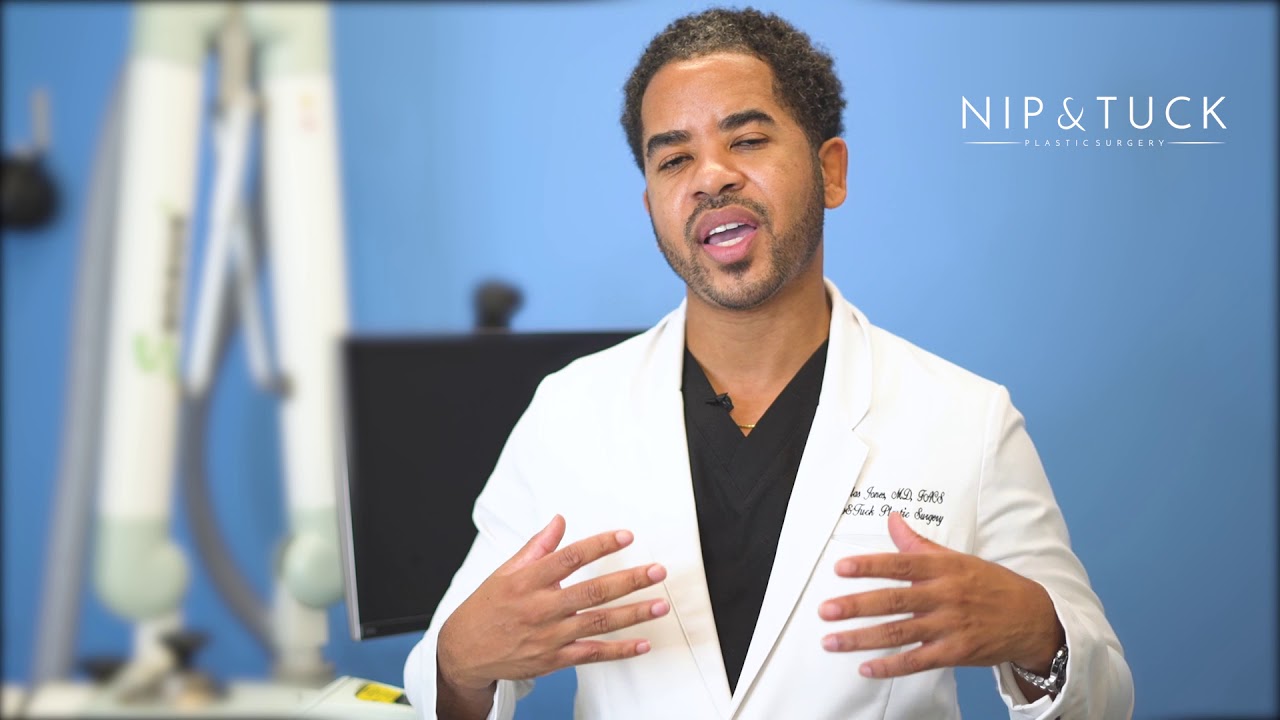 Plastic surgeon discussing liposuction before and after.