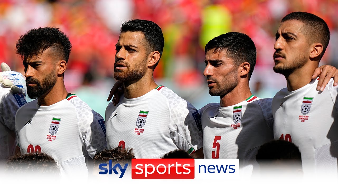 Loud jeers heard in stadium as Iran players sing national anthem before Wales game