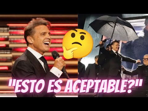 Tunden a LuisMi por dar un mini concierto y tener a un hombre cubriéndolo de la lluvia en Argentina