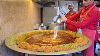 Famous Spicy Indian Curry Serve with Bread - Indian Street Food