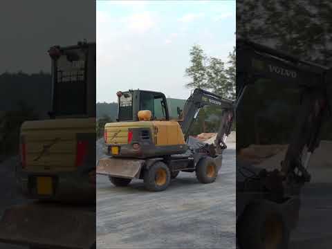 Máy Xúc Volvo Ew60c Và Xe Ô Tô Tải Ben TMT