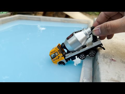 Die cast Model Cars Moving Down On the Slope into a Blue Water