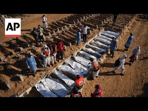 YouTube video thumbnail: Bodies of 14 Palestinians Handed Over by Israel as Part of Ceasefire Deal Buried in Central Gaza