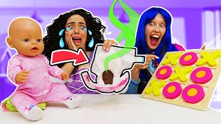 Who will play with the baby doll? Princesses can't decided who will change baby doll's diaper.
