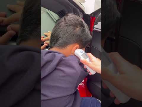 School nurse checks sons temperature #shorts