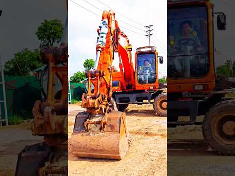 Máy xúc biểu diễn lắp cặp gầu. #excavator