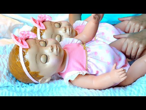 Twins sisters playing  with  twins dolls by Super Polina