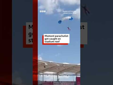 A parachutist had to be rescued after getting stuck on a rugby stadium roof. #France #Rugby #BBCNews