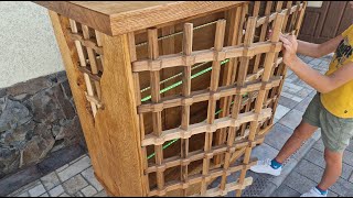 A cabinet made of red oak with lattice walnut doors