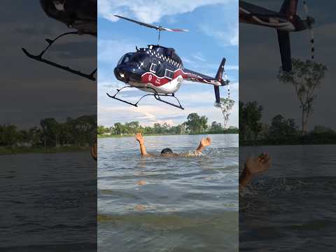 The helicopter was flying over the village pond, then