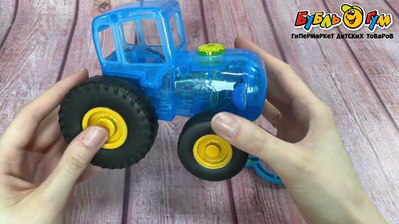 Каталка на веревке УМка Синий трактор световые эффекты 7песен 3загадки - видео