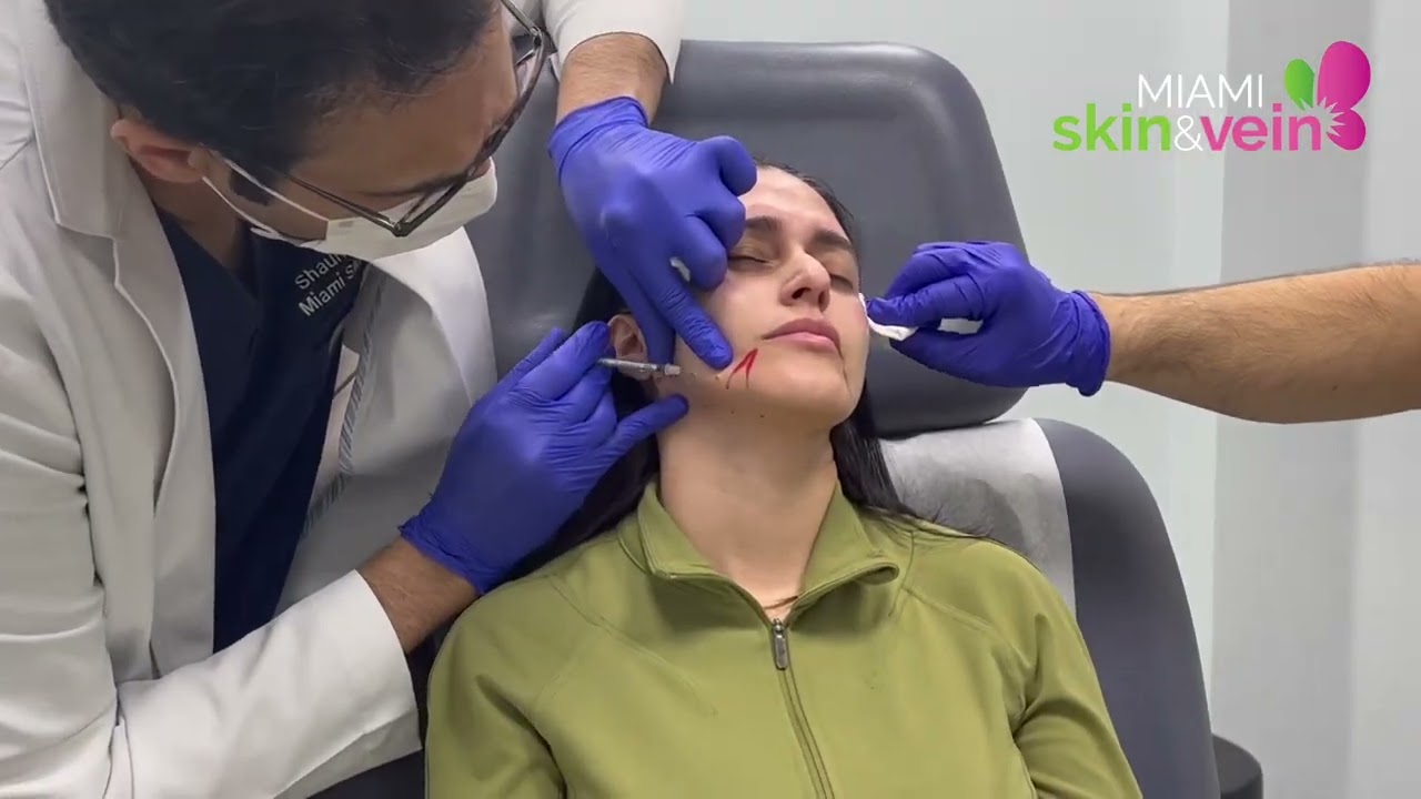 Woman with markings for cosmetic procedure preparation.