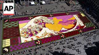 YouTube video thumbnail: Giant Flower Carpet Covers Grand-Place in Belgium Inspired by 'The Great Wave off Kanagawa'