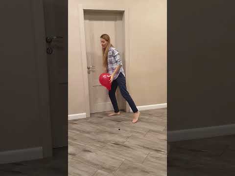 Tanya brings a red balloon to the dog