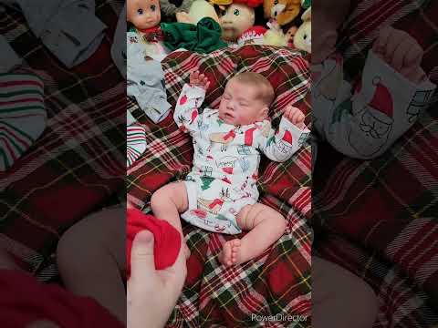 Changing Baby into Christmas Outfit
