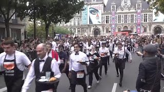 Servers in Paris take part in race through streets showing off loaded tray-balancing skills