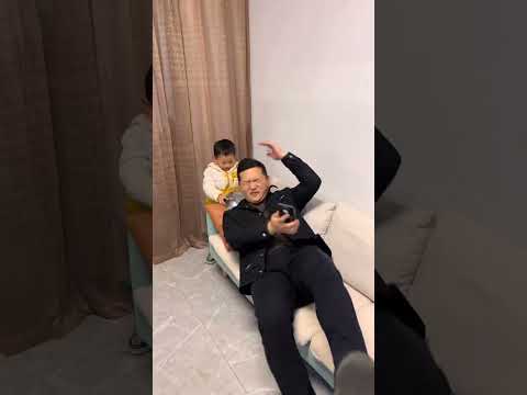 The little one who teases his father's mischievous behavior. Father and son. Cute baby's funny d