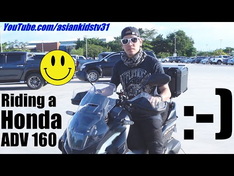 Riding a Honda ADV 160 in a Parking Lot. Riding a Black Scooter. Adventure Scooter by Honda. Ride!