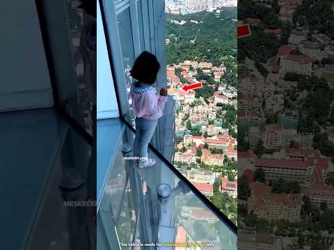 Girl narrowly escapes falling from glass bridge