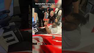 Bodybuioder tries to fit in a formula car