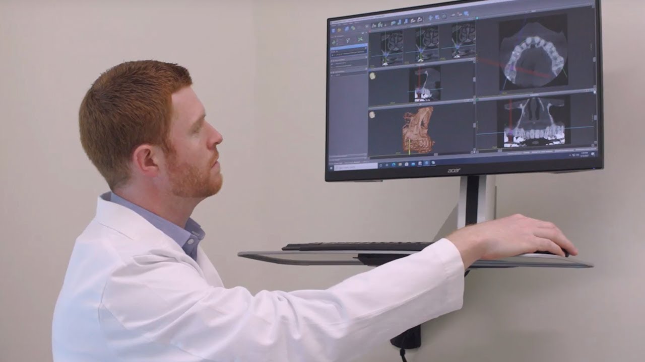 Two oral surgeons walking down a hallway