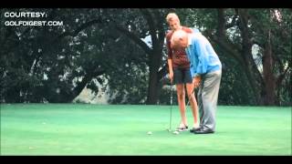 Kate Upton gives Arnold Palmer a golf lesson