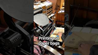 Printing our museum info on paper bags using our 10x15 Chandler & Price jobbing press-Shorts version