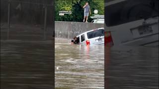 Man Rescues Driver from Car Sinking in Floodwaters
