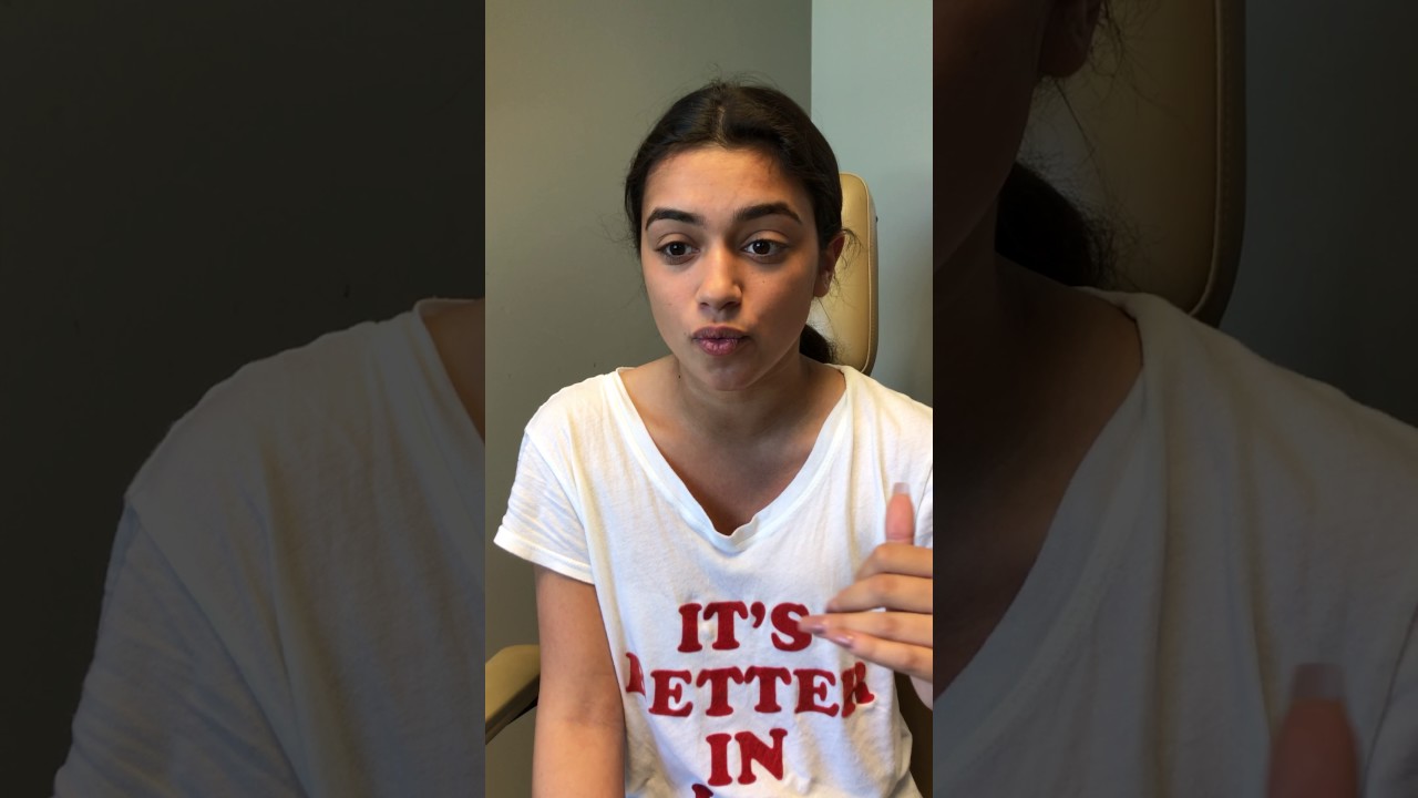 Young person speaking in a casual setting.