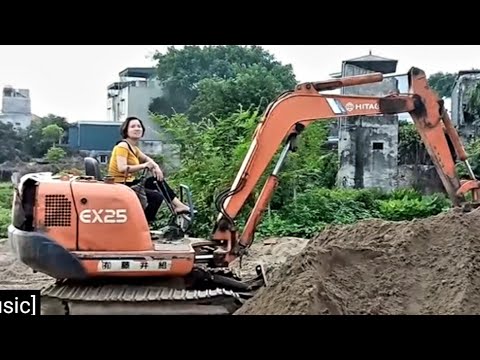 Ly Thi Ca drives an excavator very professionally