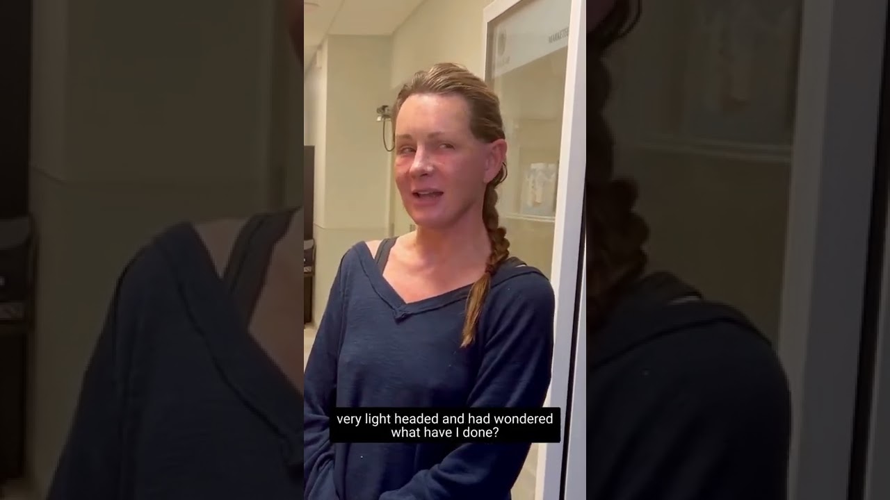 Person looking concerned in a medical setting.