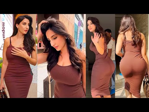 Nora Fatehi flaunting her Perfect Chubby figure in tight brown outfit