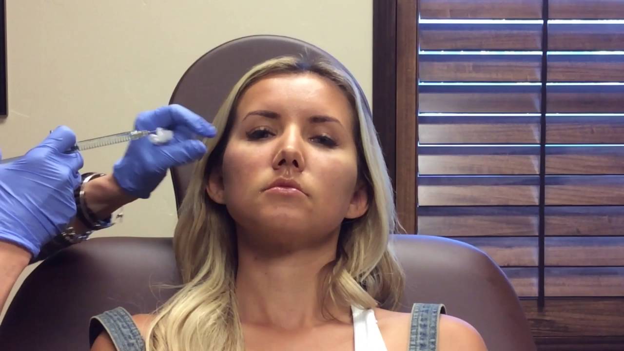 Patient receiving cosmetic injection treatment.