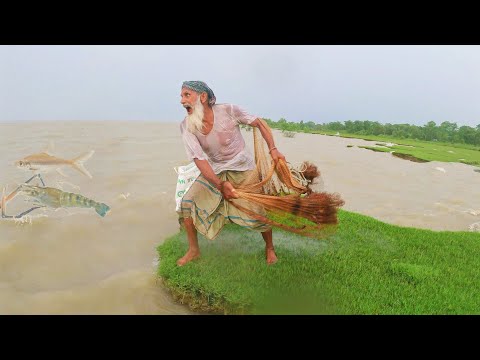 Natural cast net fishing in river - net fishing in rainy day - amazon fishing