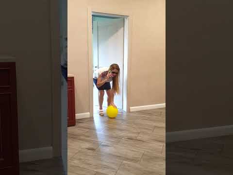 A little doggie takes a yellow balloon from Tanya
